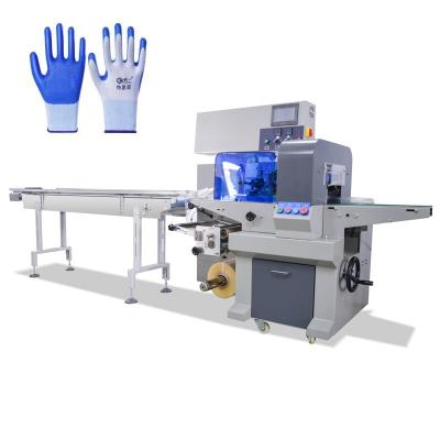 Glove packing machine